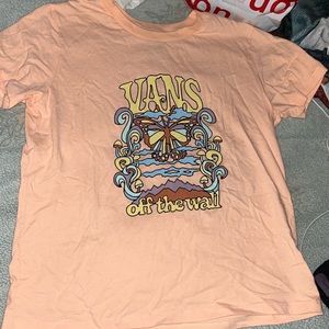 Vans, pink T-shirt.